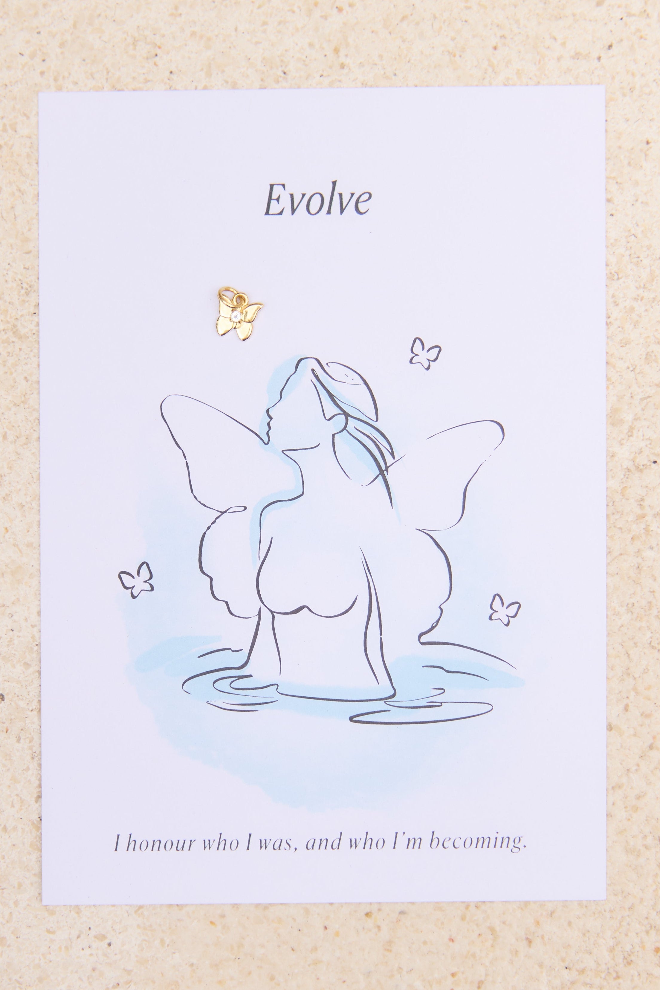 Feminine butterfly illustration and charm with word Evolve on a textured beige background
