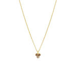 Gold necklace with a smoky quartz triangle-shaped pendant on a white background