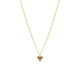Gold necklace with a smoky quartz triangle-shaped pendant on a white background