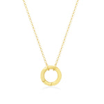 Gold necklace with a circular pendant on a white background