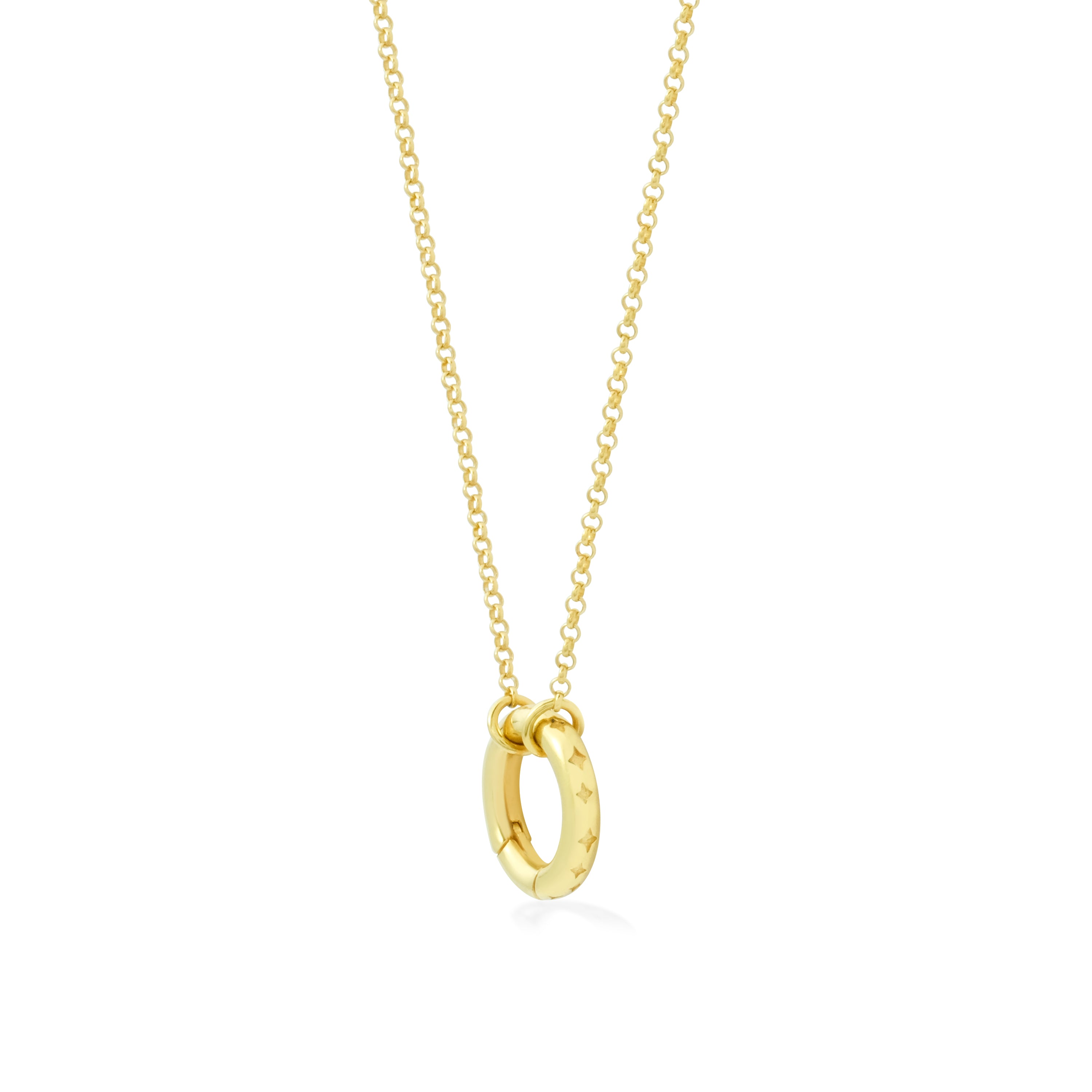 Gold necklace with a small round pendant inset with sparkle shapes on a white background