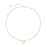 Gold necklace with a small round pendant on a white background