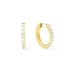 Gold hoop earrings with clear gemstones on a white background