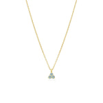 Gold necklace with a small triangular aquamarine pendant on a white background