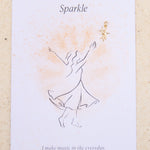 Feminine illustration and star charm with the word 'Sparkle' on a beige background
