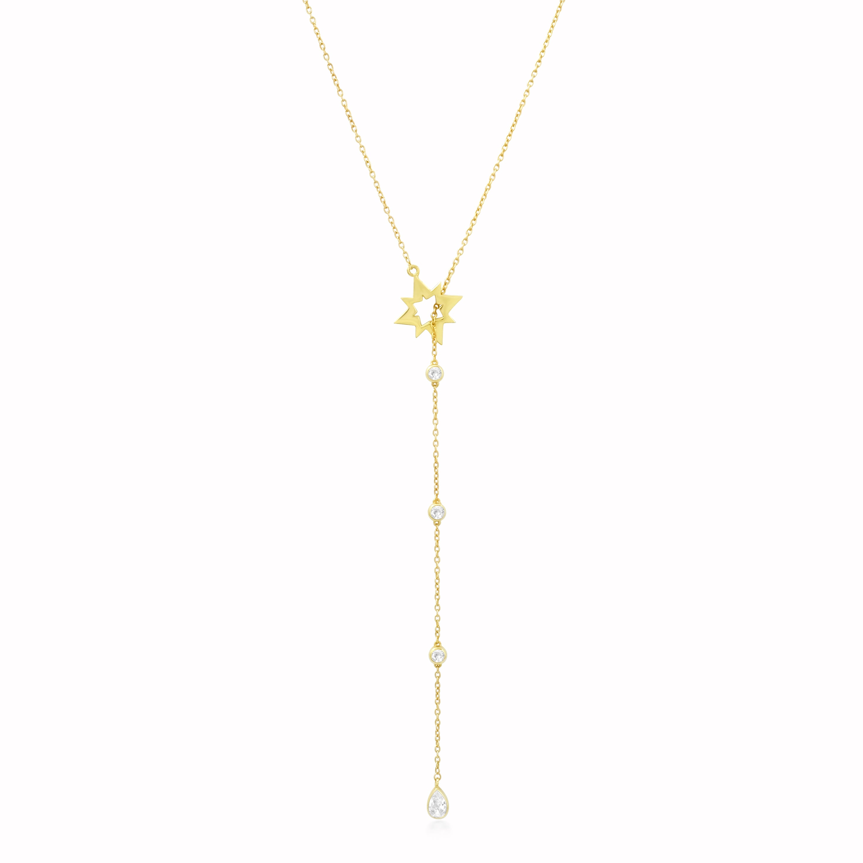 Gold necklace with star and clear stone pendant on a white background