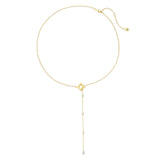 Gold necklace with star and clear stone pendant on a white background