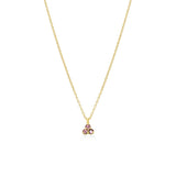 Gold necklace with a small pink triangle gemstone pendant on a white background