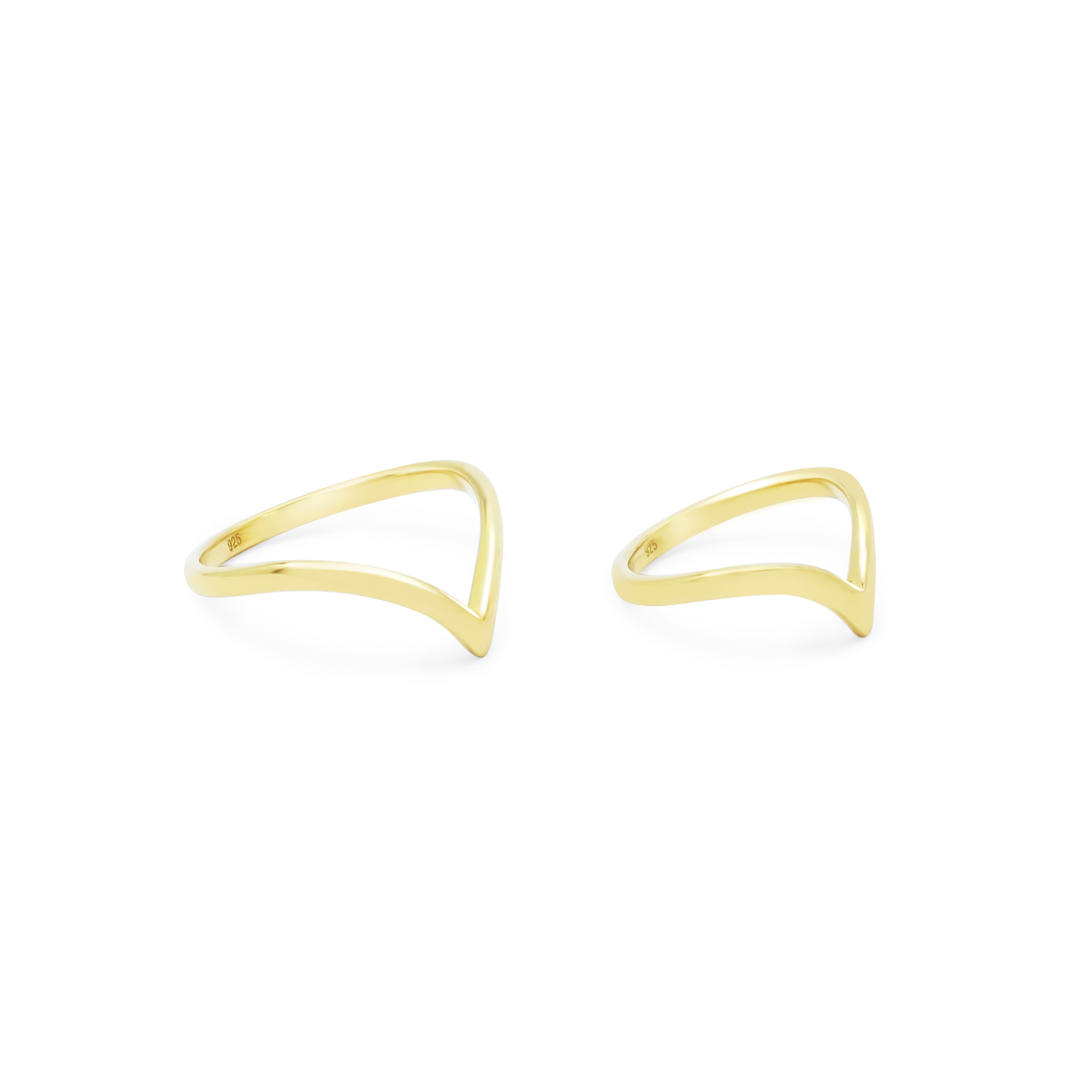 Gold open ring set on a white background