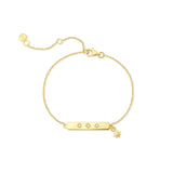 Gold bracelet with stars and clear stones on a white background